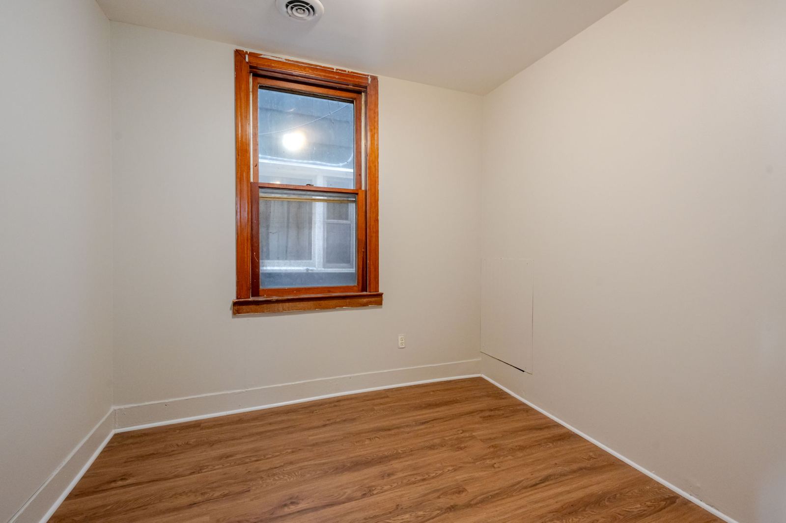 Bedroom with wood-look flooring