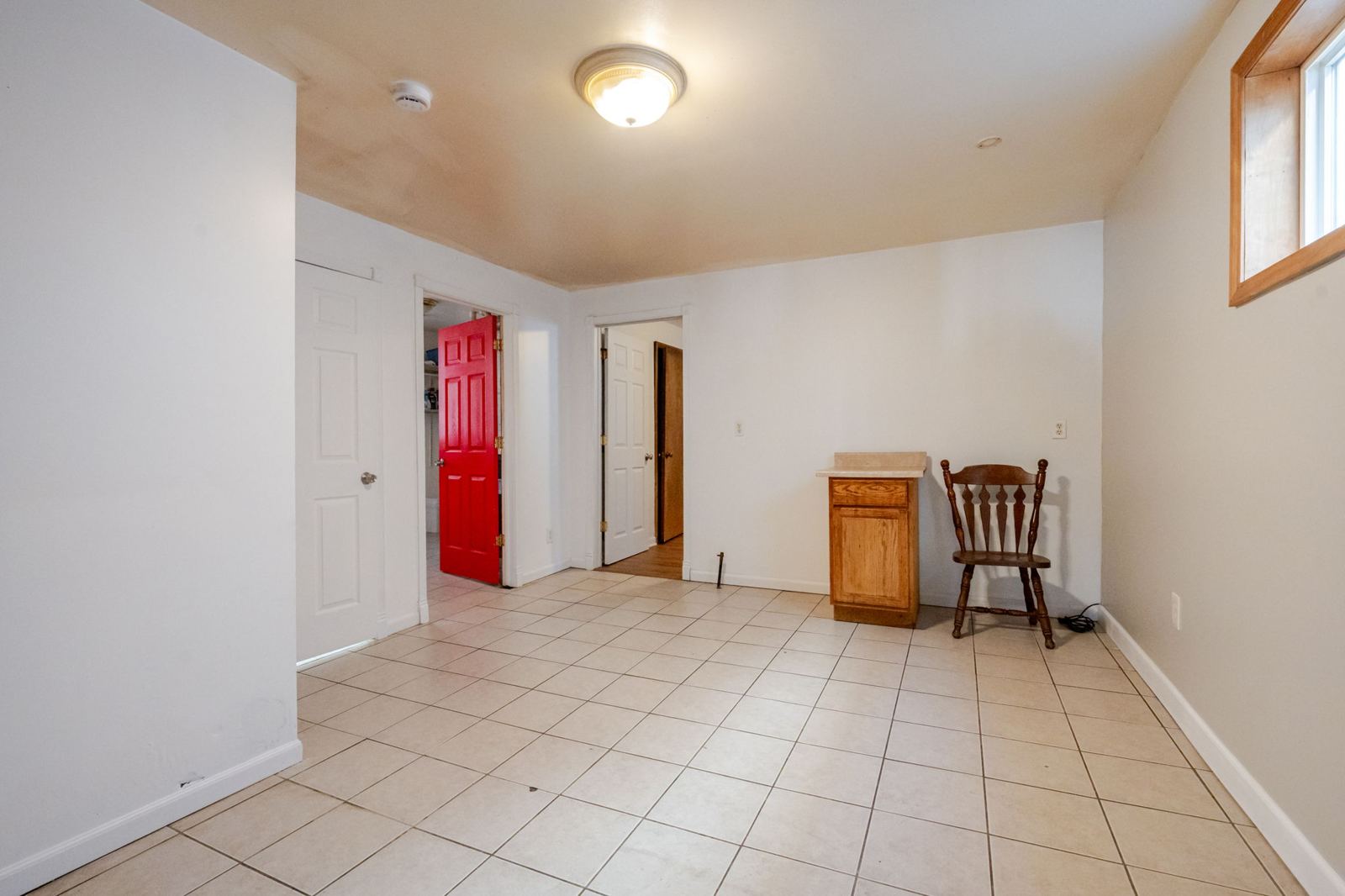 Kitchen and dining area with a tile floor