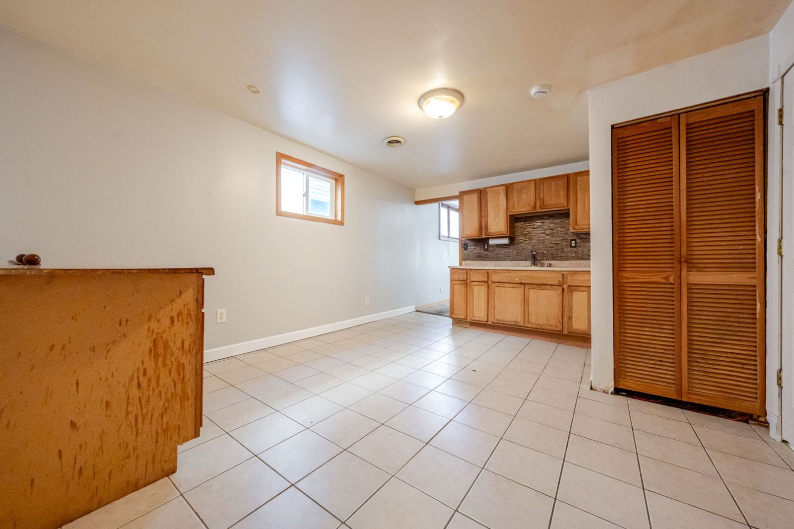 Kitchen with wood cabinets and a tile floor