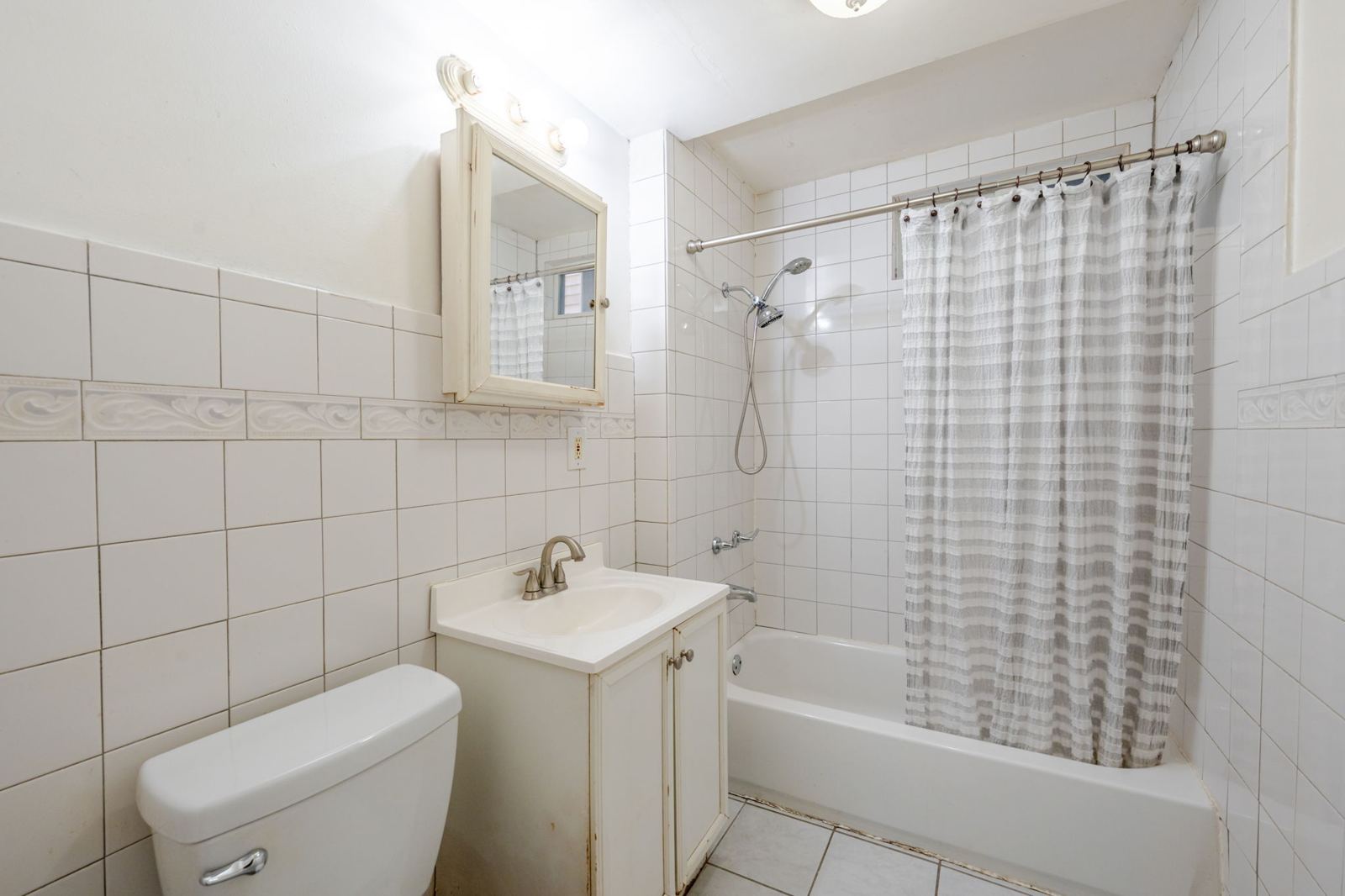 Bathroom with a tub and shower