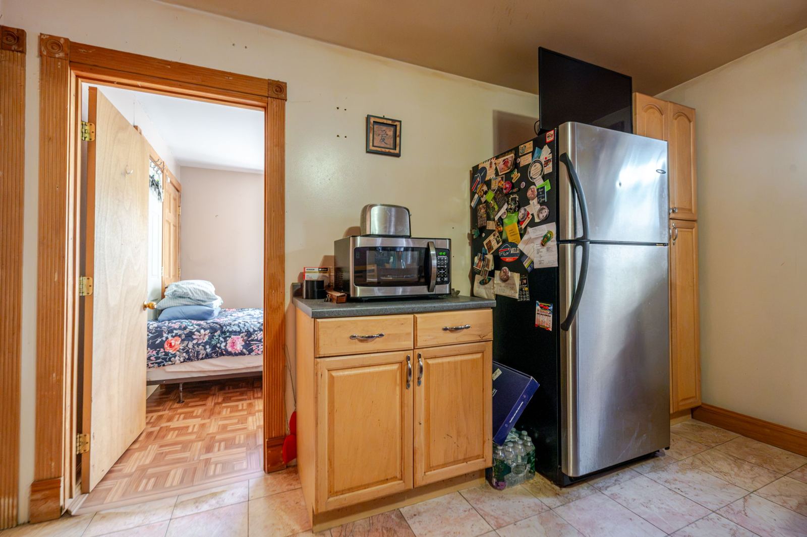 Kitchen, looking toward a bedroom